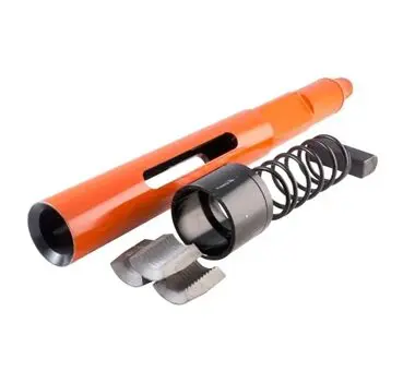 A picture of an orange pipe with parts attached.